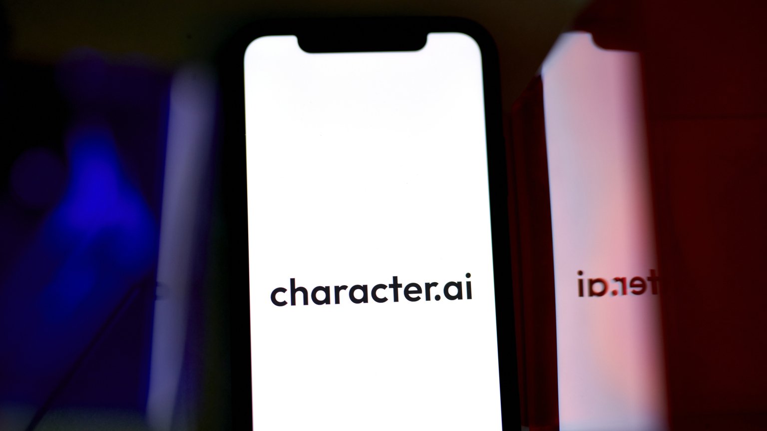 A phone screen showing the Character.AI logo.