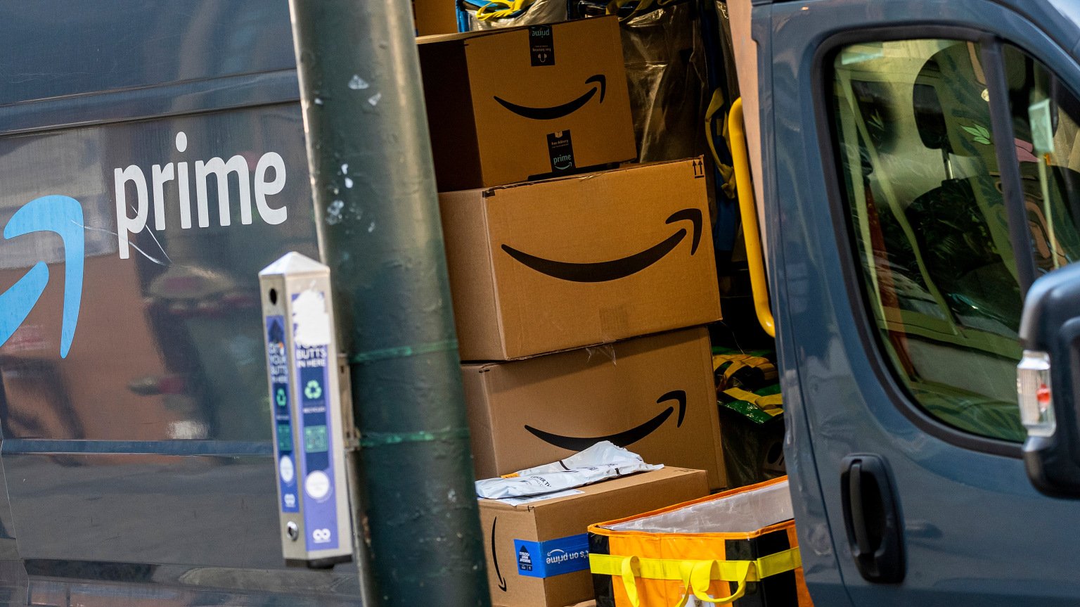 A view inside of an Amazon delivery truck filled with boxes.