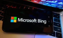 The Microsoft Bing logo on a dark phone screen.