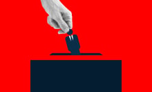 Human hand placing an icon of man wearing suit into the voting box.