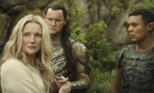 A still from "The Rings of Power" showing three elves gathered.