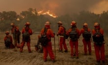 Firefighters battle the Mountain Fire in Moorpark, Calif.