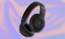 black beats studio pro headphones on a purple and orange swirling background