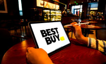  In this photo illustration, a Best Buy logo is displayed on the screen of an iPad