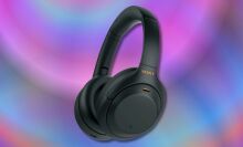 black sony wh1000xm4 wireless headphones on a purple and blue background