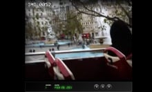 screenshot of a video showing a tour bus going through london