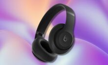 black beats studio pro headphones on a purple, light blue, and yellow wavy background