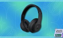 black beats studio 3 headphones on a blue and green patterned background