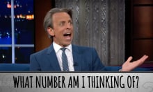 A man in a suit gestures on a talk show with his mouth open. The caption at the bottom reads, "What number am I thinking of?"