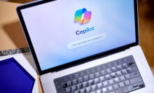 The Copilot logo arranged on a laptop 