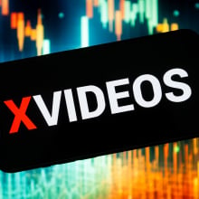 In this photo illustration a Xvideos logo seen displayed on a smartphone