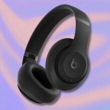 black beats studio pro headphones on a purple and orange swirling background