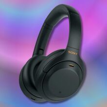 black sony wh1000xm4 wireless headphones on a purple and blue background