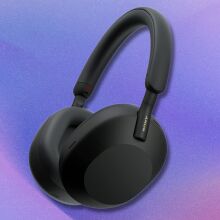 black sony wh1000xm5 headphones on a purple and pink gradient background