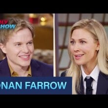 A side by side still of Ronan Farrow and Desi Lydic at the Daily Show news desk.