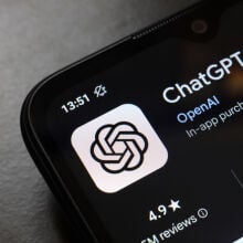 The ChatGPT app logo displays on the screen of a smartphone