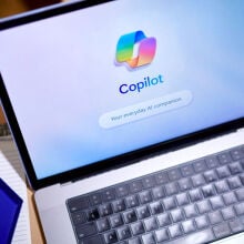 The Copilot logo arranged on a laptop 