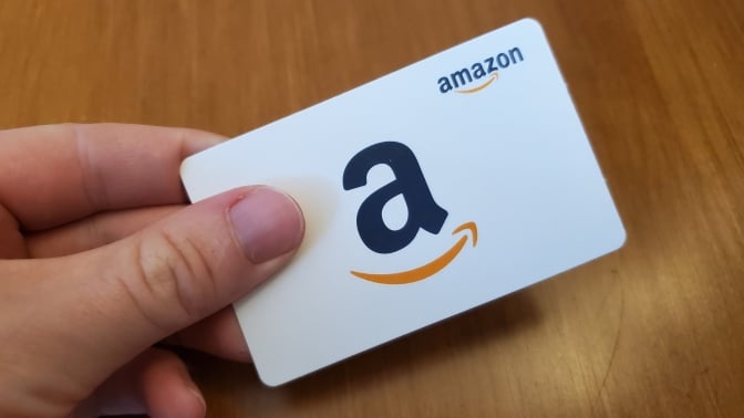 hand holding Amazon gift card