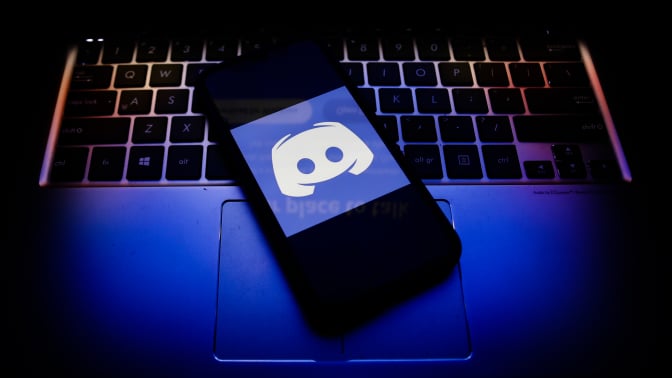 Discord logo displayed on a phone screen