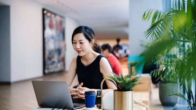 Young Asian businesswoman working in a modern office space