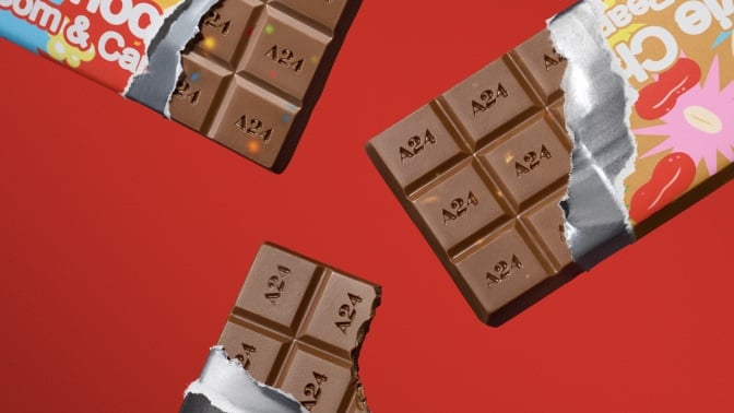 Three A24 chocolate bars against a red background.