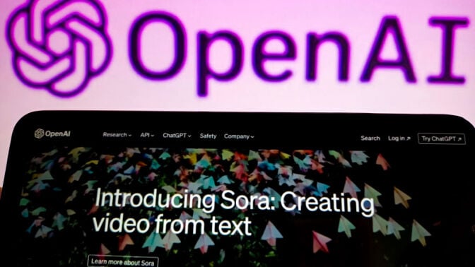 The Sora announcement on a smartphone in front of the OpenAI logo