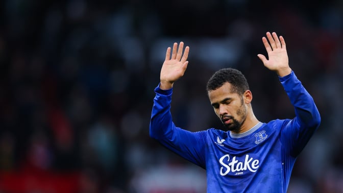 Iliman Ndiaye of Everton gestures an apology to the away supporters