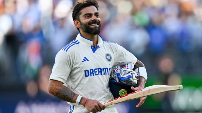 Virat Kohli of India celebrates scoring a century