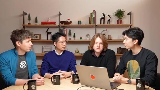 openai members seated at a table showing off a new demo