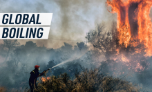 A firefighter tries to put down a raging fire. Caption reads "global boiling"