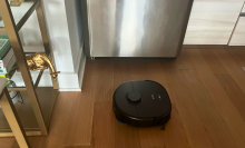 An Eufy X10 Pro Omni robot vacuum on a kitchen floor