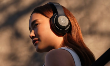 a close-up of a woman wearing beats studio pro headphones