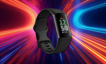 A black Fitbit Charge 6 fitness tracker with a rectangular screen displaying the time (12:58), heart rate (68 bpm), and step count (7,546). The band has a textured finish and a simple buckle closure. It's shown against a vibrant, abstract background of swirling red, blue, and yellow lights.