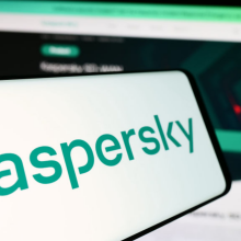 The Kaspersky logo on a mobile phone.