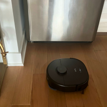 An Eufy X10 Pro Omni robot vacuum on a kitchen floor