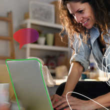 A woman using a laptop.