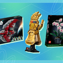 A Star Wars Lego box, Marvel Infinity Gauntlet Lego, and Lego Orchid box arranged on blue and green backdrop