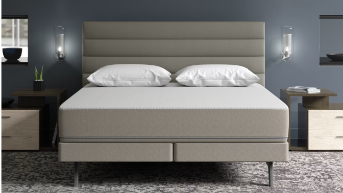 Sleep Number mattress and bed frame by nightstands and lamps