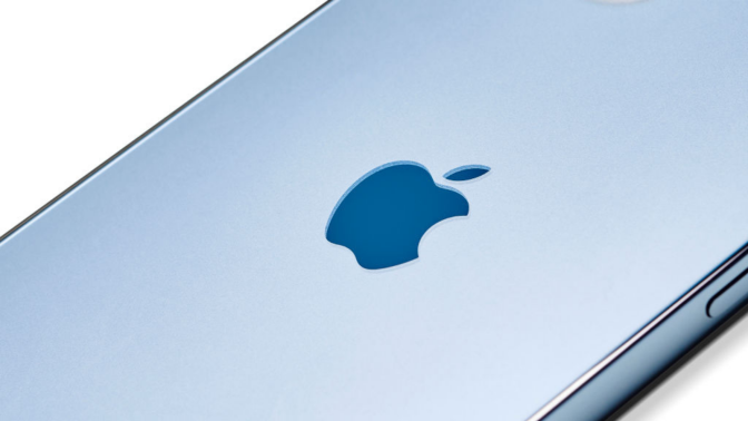 A close up of the logo on an Apple iPhone 12 Pro with a Pacific Blue finish.