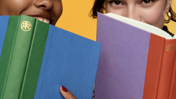 who women peeking out from behind books