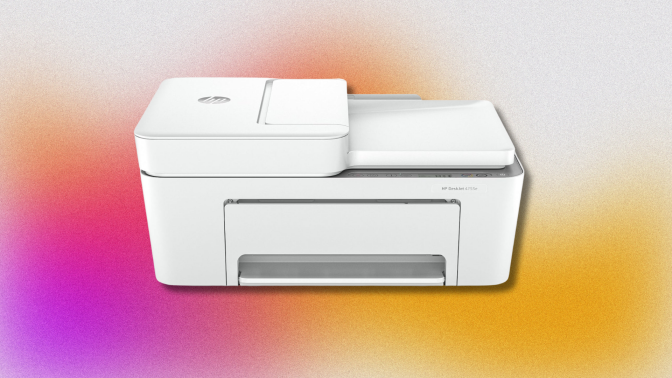 A white HP DeskJet 4255e all-in-one printer with the paper tray extended and a sheet of paper feeding into the top. It's set against a colorful, abstract background with pink, orange, and yellow tones.