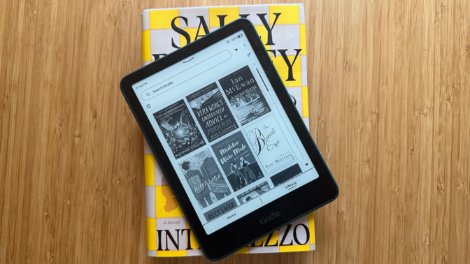 A Kindle on top of the book Intermezzo by Sally Rooney