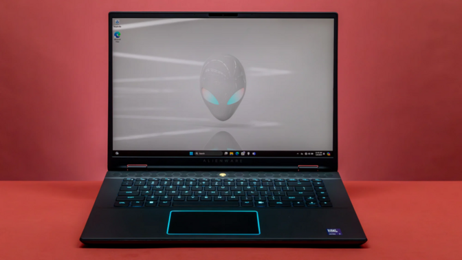 the alienware m16 r2 against a reddish-orange background